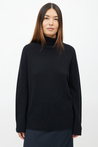 The Row // Black Wool Knit Turtleneck – VSP Consignment