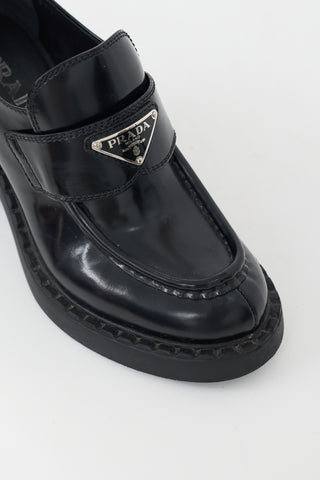 Black Leather Triangle Logo Heeled Loafer