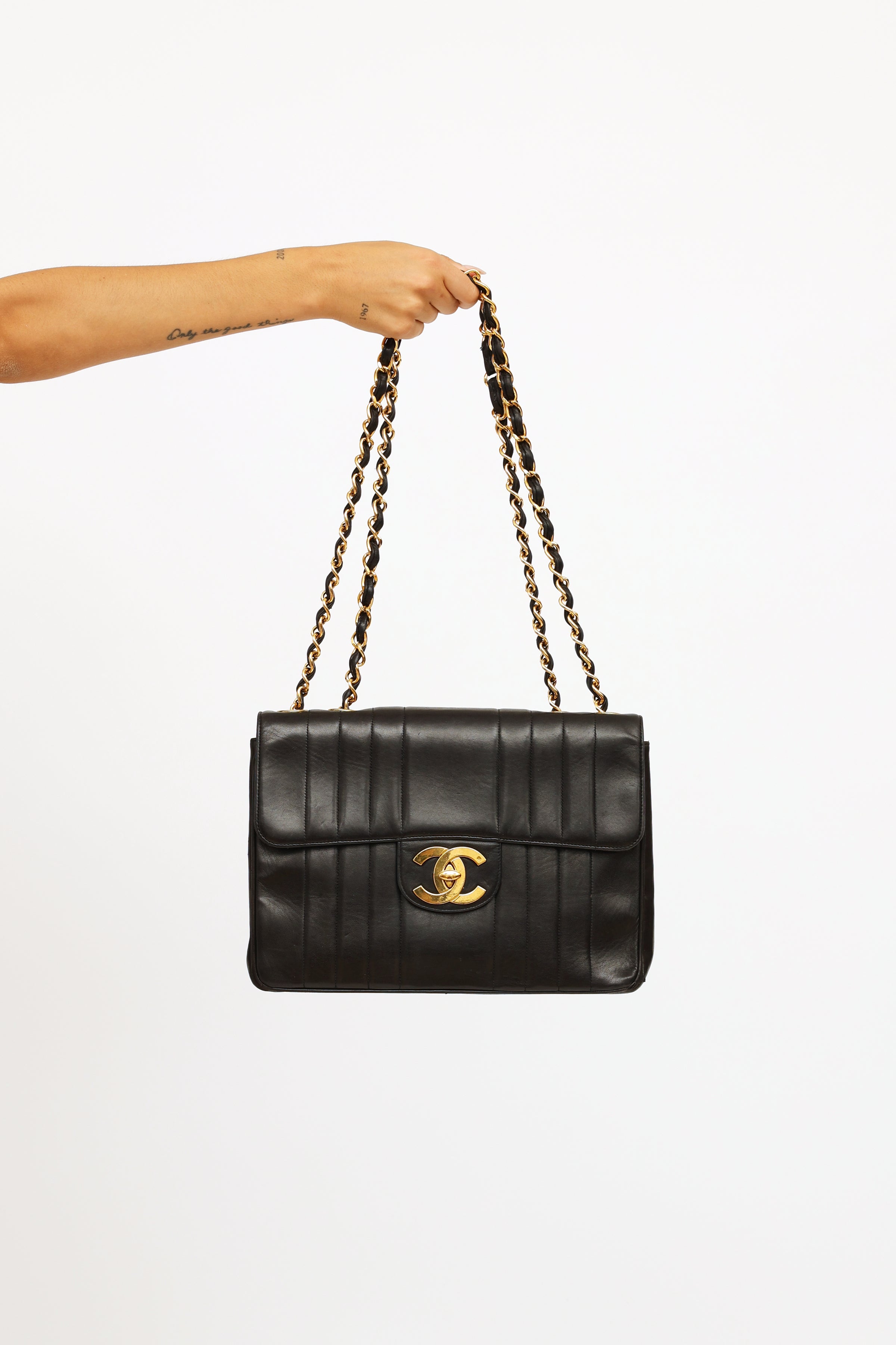 Chanel // Black Vertical Quilt Lambskin Flap Bag – VSP Consignment