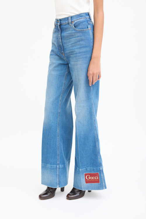 Gucci Medium Wash Logo Patch Flared Jeans