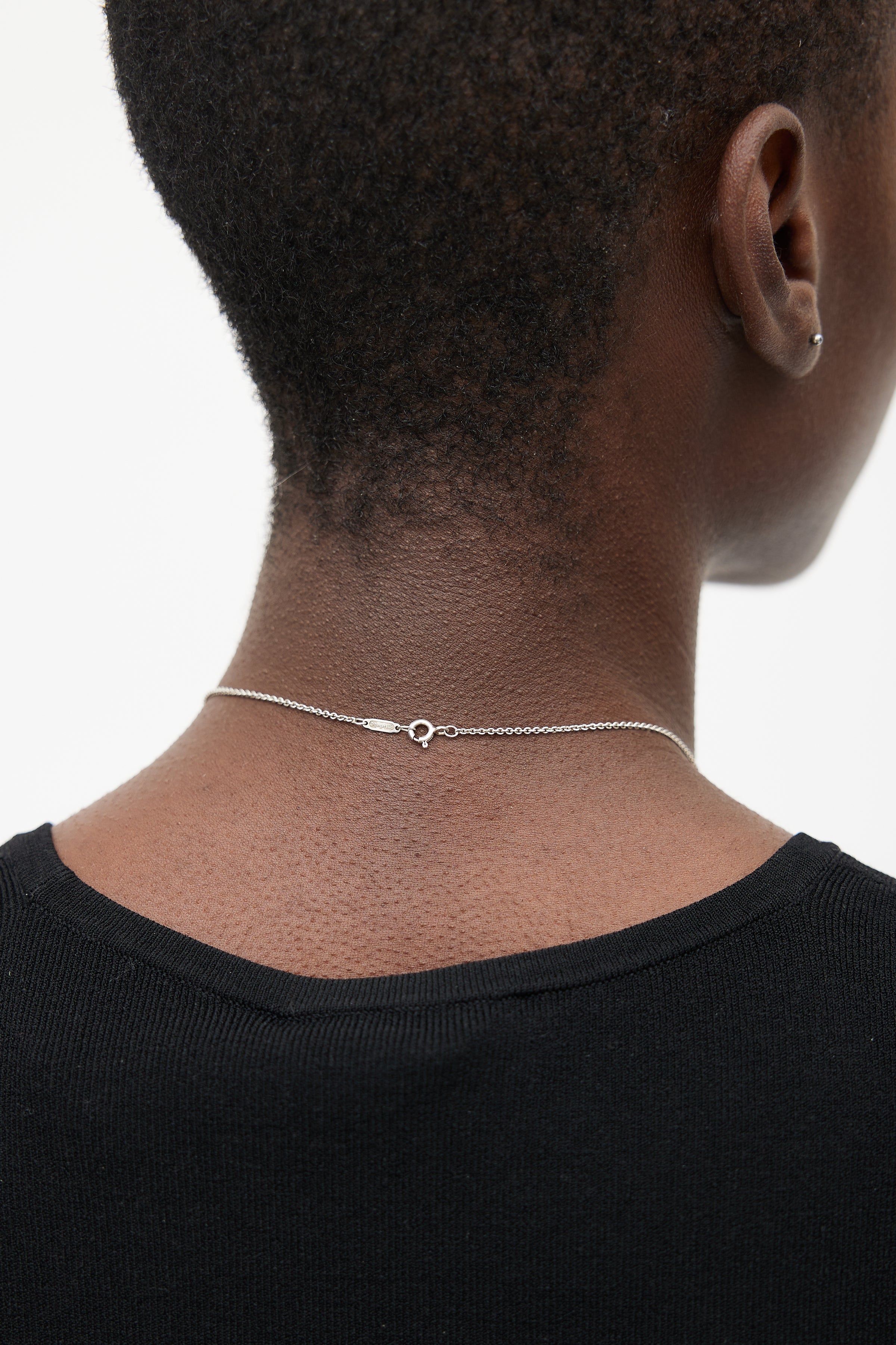 Elsa Peretti™ Open Heart pendant in sterling silver with a diamond. |  Tiffany & Co.
