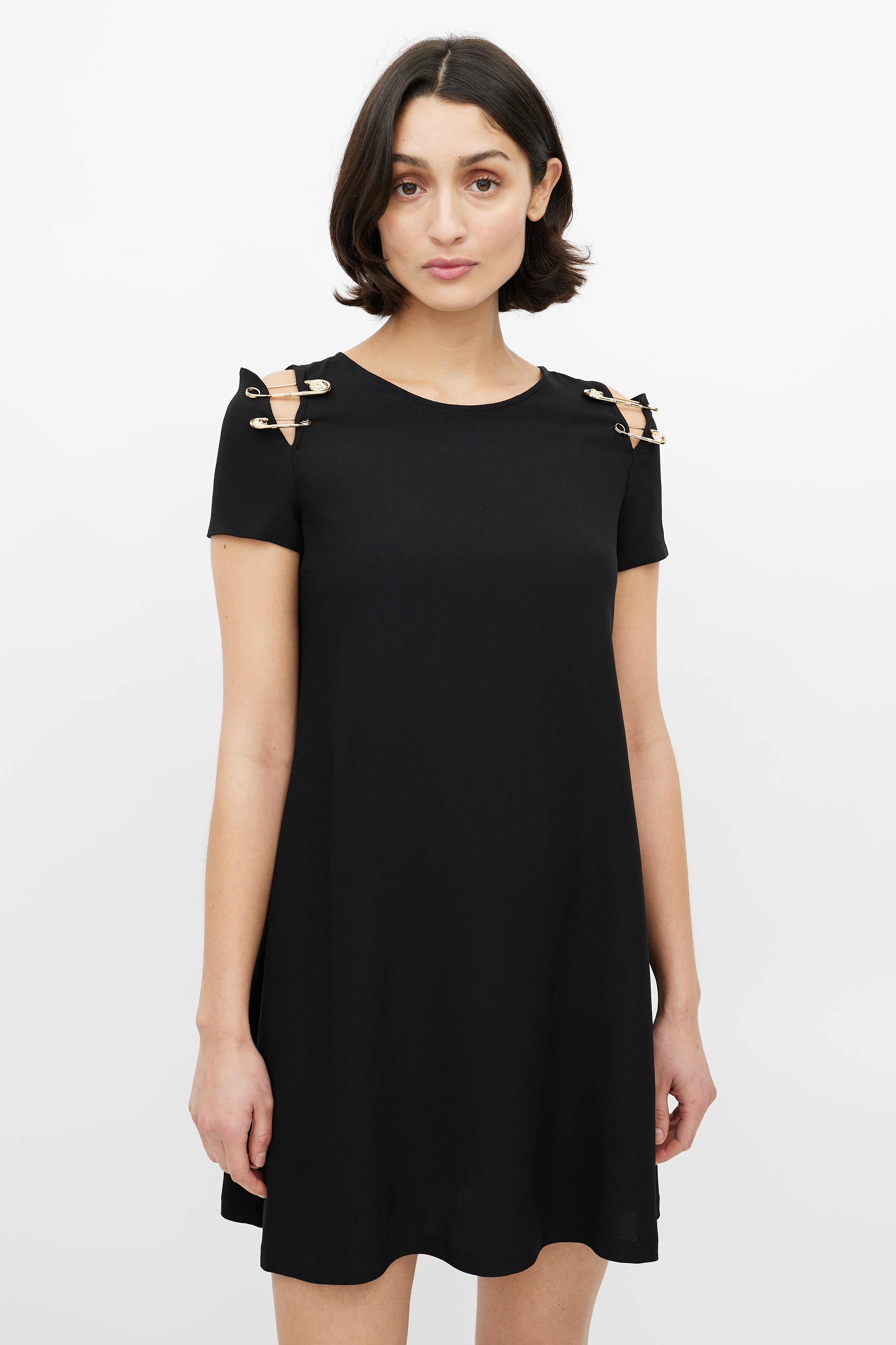 black versace dress with gold safety pins Elizabeth Hurley's Versace Safety Pin Dress Gets a Modern Update