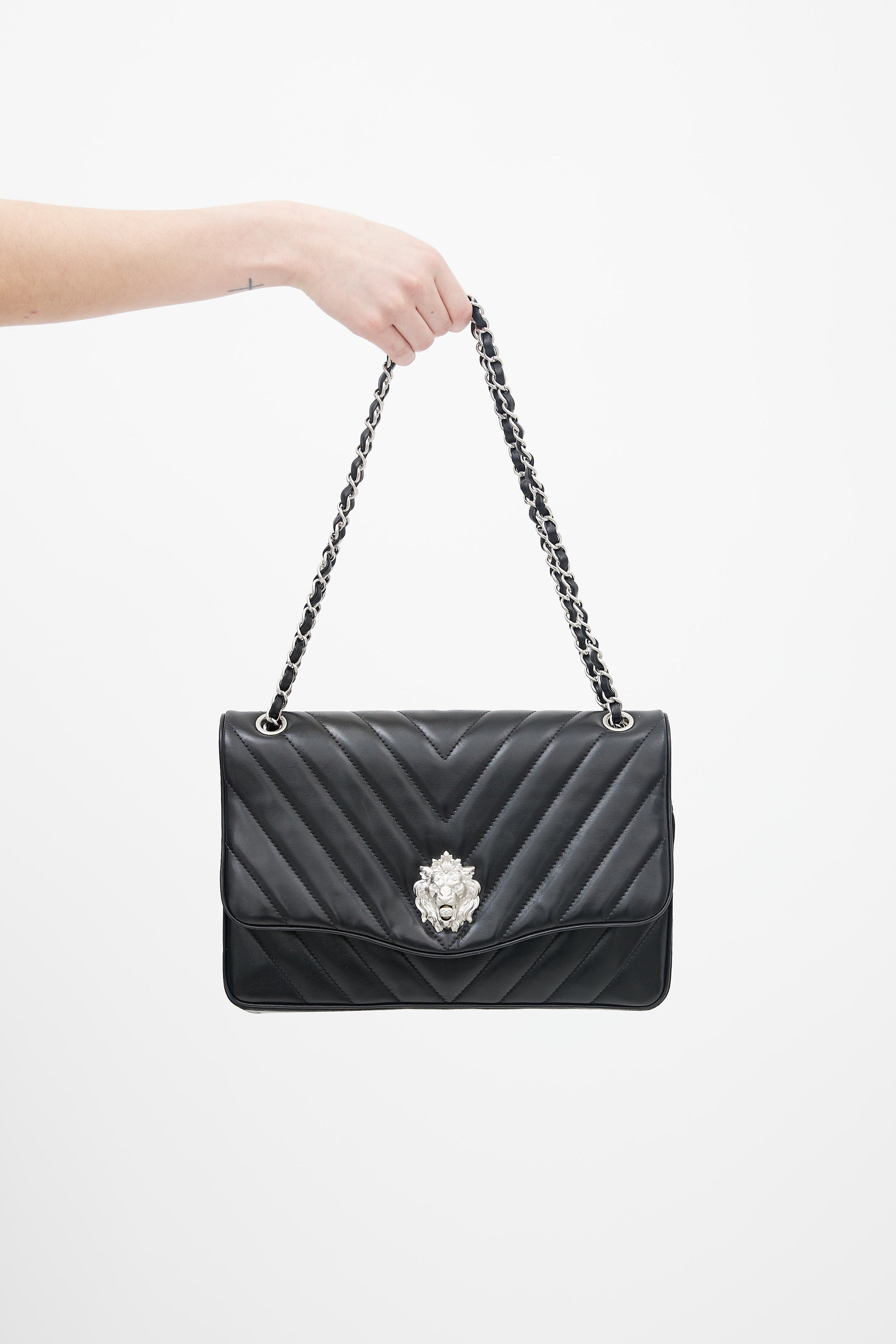 Chanel // 2010 Black Chevron Leather Leo Flap Bag – VSP Consignment